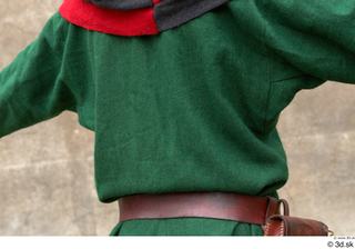  Photos Medieval Servant in suit 4 Green gambeson Medieval clothing bag grey red and hood leather belt medieval servant upper body 0005.jpg
